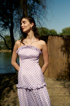 Model wearing the Ruffle Halter Polka Dot Maxi Dress by Hazar Azhari