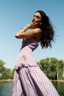Side profile of the Ruffle Halter Polka Dot Maxi Dress by Hazar Azhari