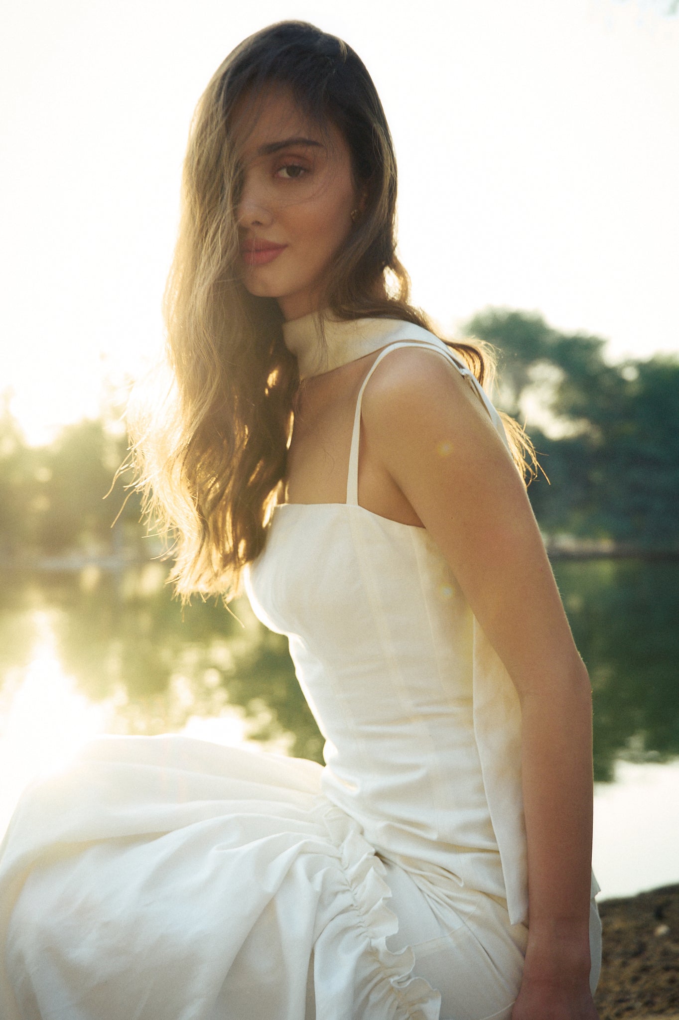Model close up wearing the Hazar Azhari Square Neck Ruffle Hem Maxi Dress with a matching neck scarf.