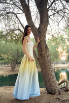 Side view of the model wearing the Hazar Azhari Ombre Gathered Maxi Dress.